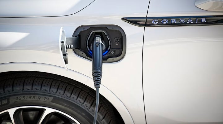 An electric charger is shown plugged into the charging port of a Lincoln Corsair® Grand Touring
model. | Thomasville Lincoln in Thomasville GA