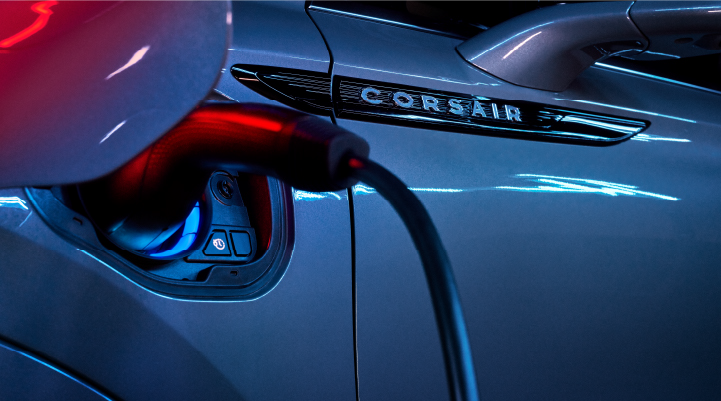 A charger plugged into the charging port of a 2025 Lincoln Corsair® Plug-in Hybrid model. | Thomasville Lincoln in Thomasville GA