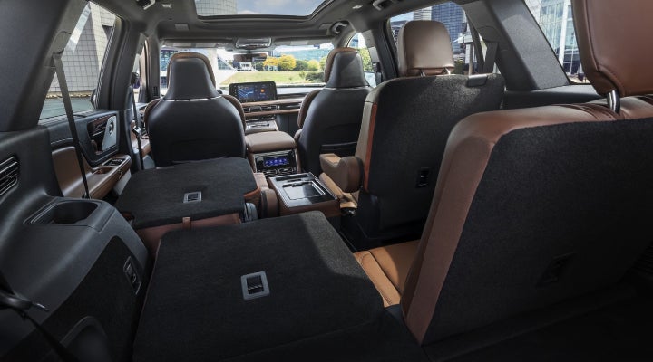 One side of the PowerFold® third-row seat and a second-row seat are folded forward in the 2026 Lincoln Aviator® SUV. | Thomasville Lincoln in Thomasville GA