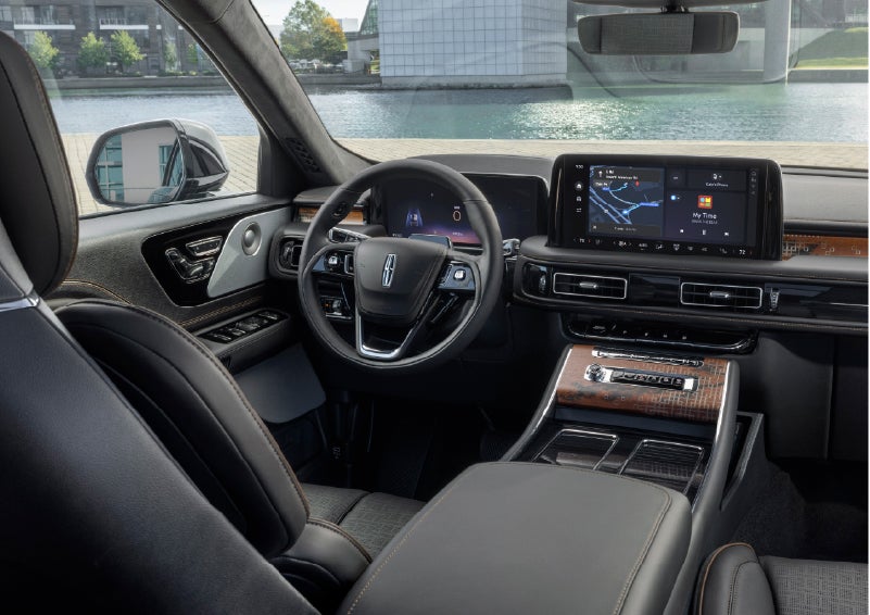 The interior of the 2026 Lincoln Aviator® SUV is shown parked with a view of a harbor through the windshield. | Thomasville Lincoln in Thomasville GA