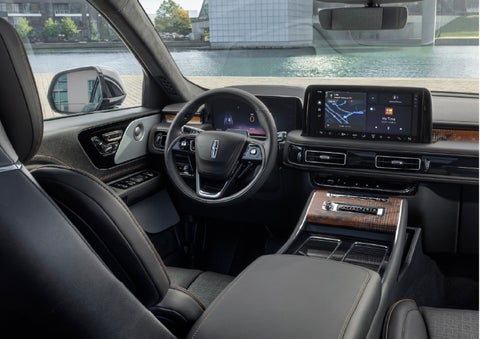 The interior of the 2026 Lincoln Aviator® SUV is shown parked with a view of a harbor through the windshield. | Thomasville Lincoln in Thomasville GA