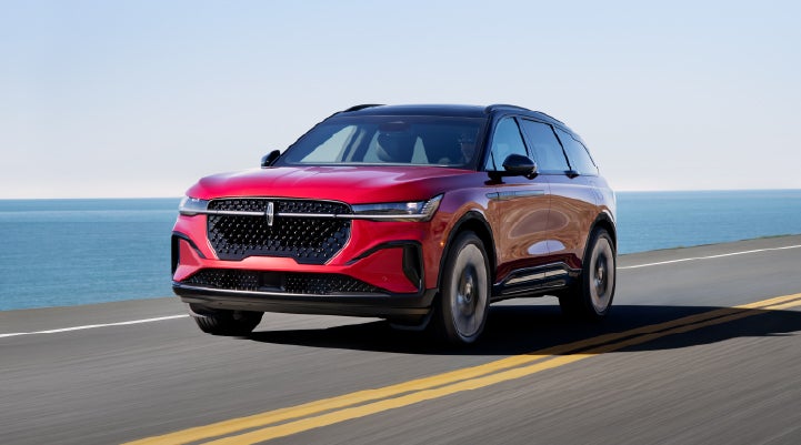 A 2026 Lincoln Nautilus® SUV is being driven on a seaside roadway. | Thomasville Lincoln in Thomasville GA