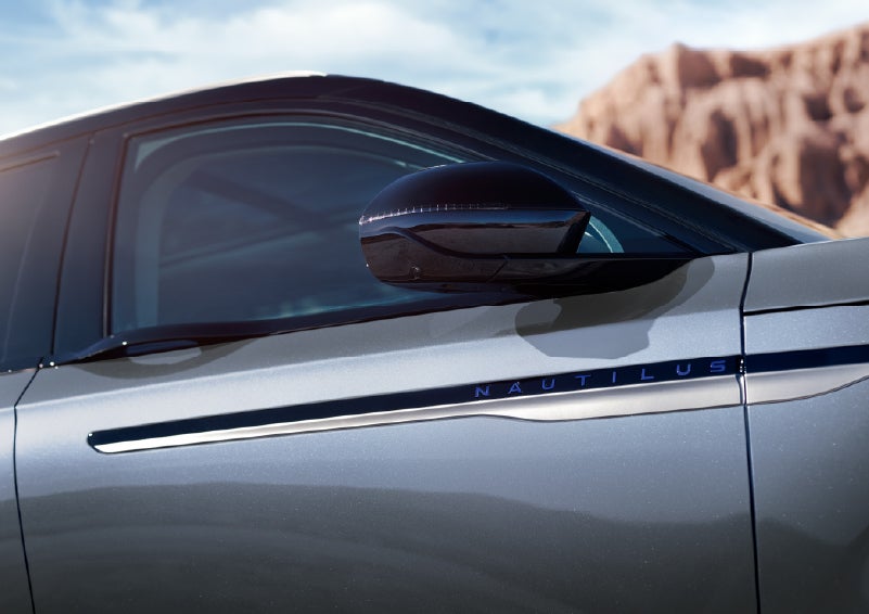 Blue lettering on the side of the vehicle that reads Nautilus indicates the available Hybrid Powertrain. | Thomasville Lincoln in Thomasville GA